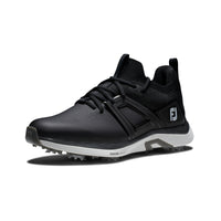 A pair of a black FootJoy hyperflex golf shoes.