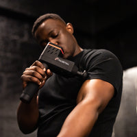 Pulseroll Ignite Pro massage gun in black.