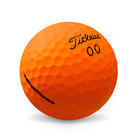 Titleist Velocity 2022 golf ball in orange.