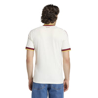 Man wearing Spain '26 Away Football Shirt from behind