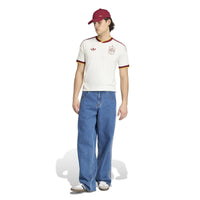 Man wearing Spain '26 Away Football Shirt from front