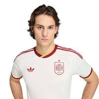 Man wearing Spain '26 Away Football Shirt close up