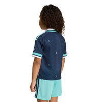 Child modelling the Germany '26 Away Football Mini Kit from behind