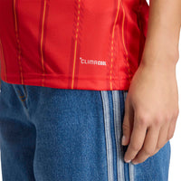 Woman Wearing Spain '26 Home Football Shirt Women's (bottom front of top)