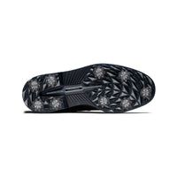 The sole of a black FootJoy premiere series packard golf shoe.