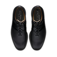 A pair of black FootJoy premiere series packard golf shoes in black.