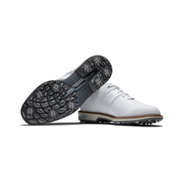 One white FootJoy Premiere Series packard golf shoe ontop of another.