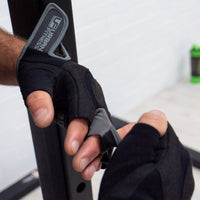 Person putting on Urban Fitness Pro Gel training glove