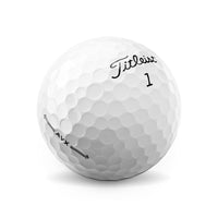 A Titleist AVX golf ball in white.