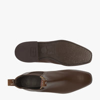 A pair of R.M. Williams comfort craftsman boots in dark tan brown.