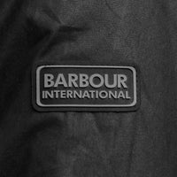 Barbour international tourer duke wax jacket in black.