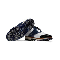 One FootJoy premier series golf shoe in navy/white ontop of another.